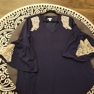 true navy color dress with lace trim on bell sleeves